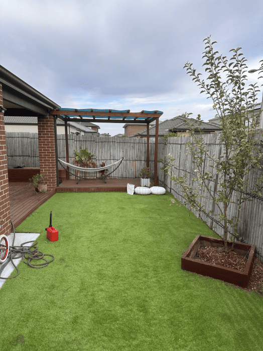 Backyard in Richmond newly laid with artificial grass by Gardenscape.