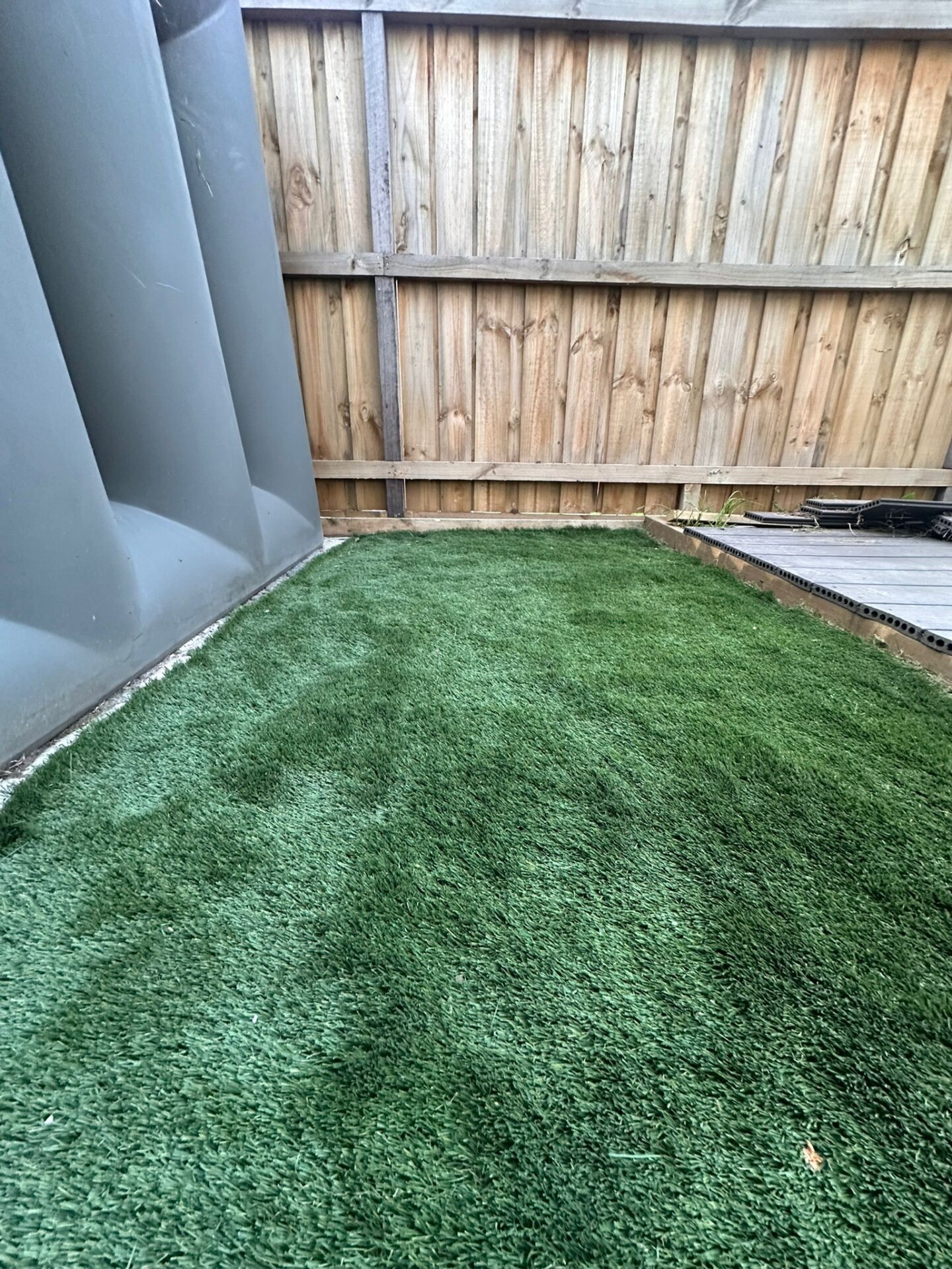Artificial turf installed by Gardenscape in a family yard.
