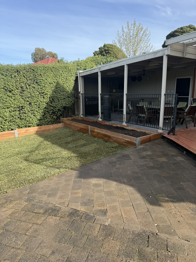 Outdoor living space designed with stone pavers